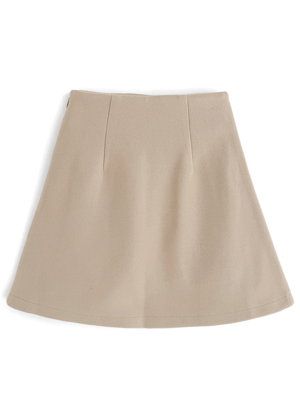 Flat-lay photo of a beige box-pleat flared mini skirt.