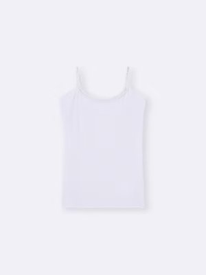 White cropped camisole with thin spaghetti straps laid flat on a light background.