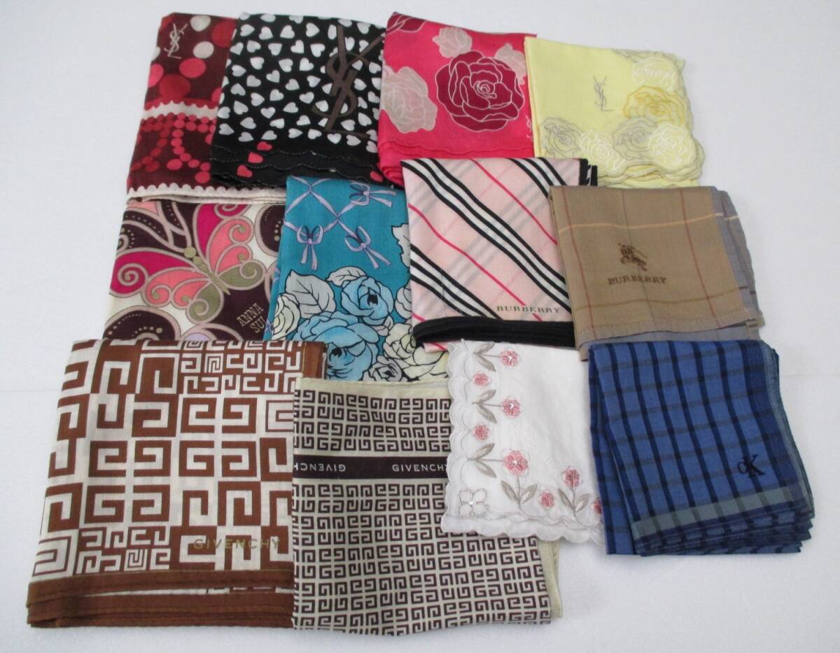 Twelve folded branded cotton handkerchiefs with various check, floral, and patterned designs laid flat on a white background.