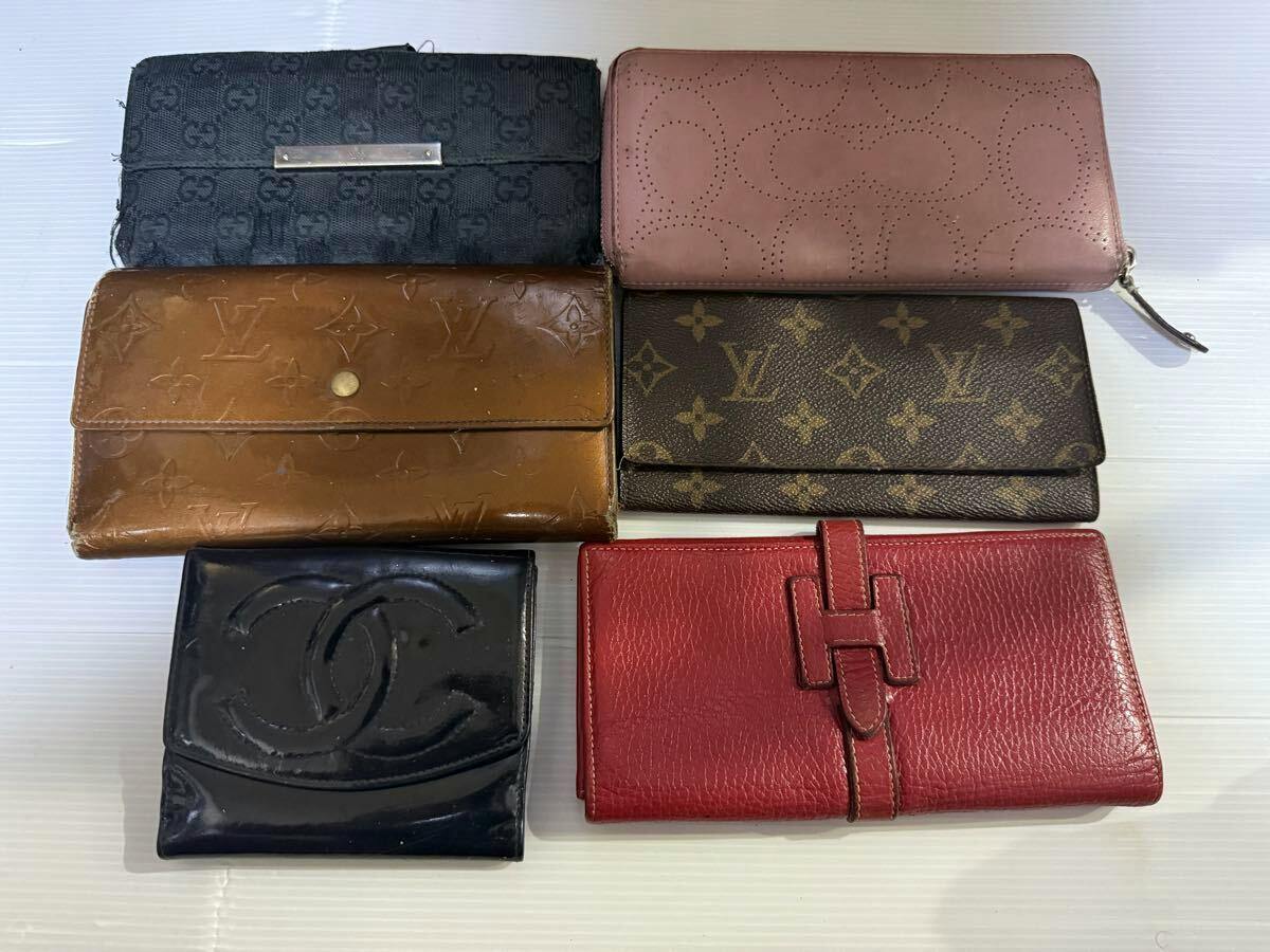 Six brand wallets (cow leather) arranged on a white background.