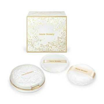 Brightening skincare powder compact with two powder puffs and the product box displayed.