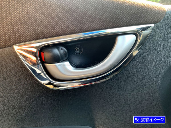 Stainless steel plated inner door handle cover installed on a car interior door handle.
