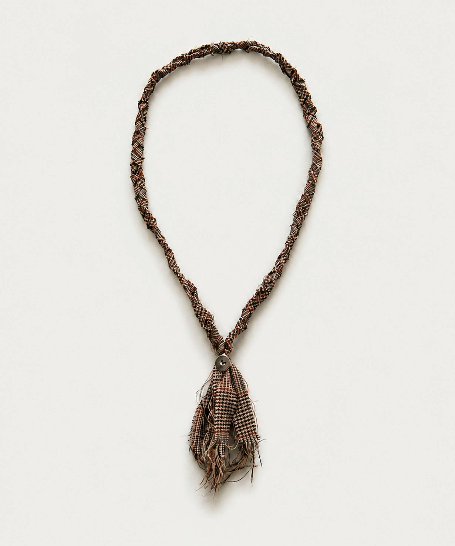 Brown braided loop tie (necktie) with a tassel, shown flat on a light background.