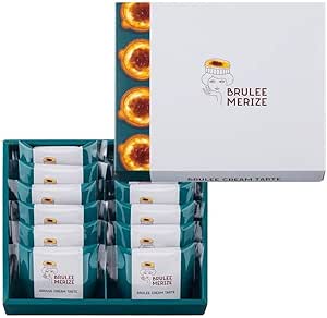 Packaged Bruleemerize boxed set showing individually wrapped custard cookies arranged in a teal tray with the white Bruleemerize lid beside it.