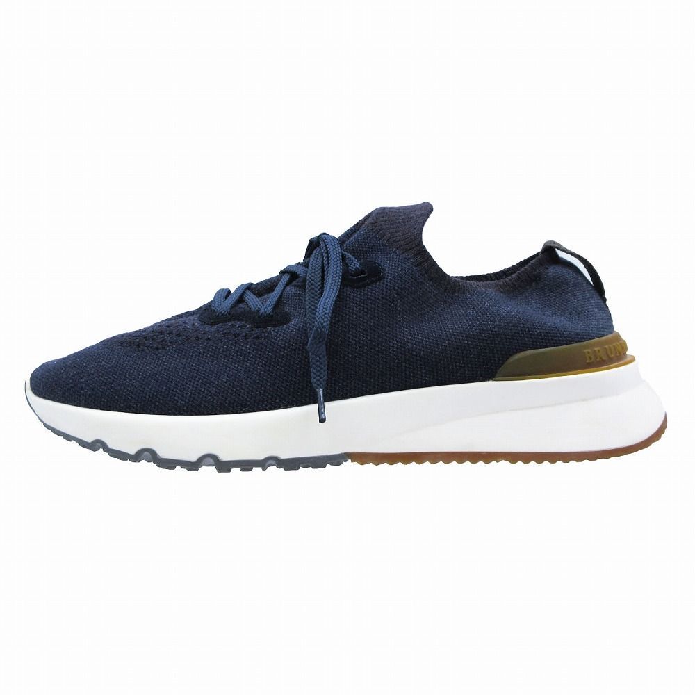 Side profile of a navy Brunello Cucinelli men's cotton knit running shoe on a white background.