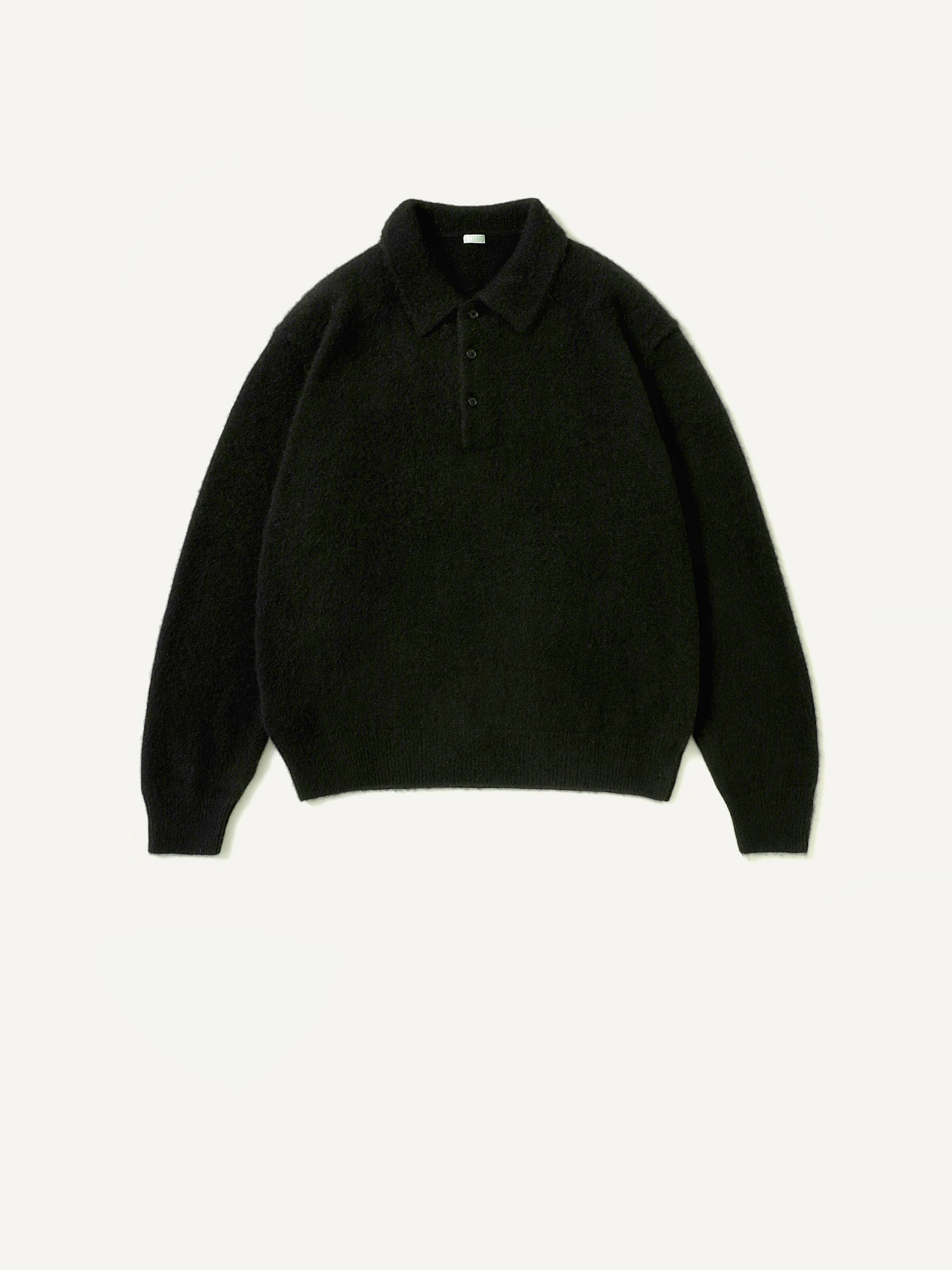 Front view of a black brushed cashmere polo-collar sweater laid flat on a light background.