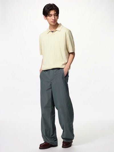 Male model wearing the men's brushed-jersey barrel-leg pants, shown full length against a white background.
