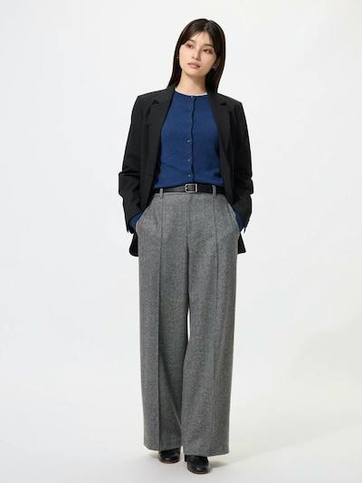 Front view of a woman wearing the brushed-jersey herringbone wide pants in gray, shown full-length with hands in pockets.