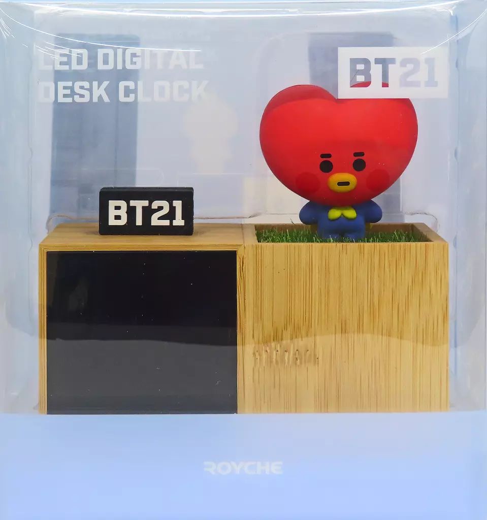 Packaged BT21 TATA LED digital desk clock showing a wooden-style base with a digital display and a red TATA character figure.