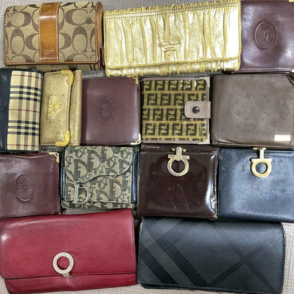 Multiple wallets and small leather goods arranged in a grid, presented as a bulk set.
