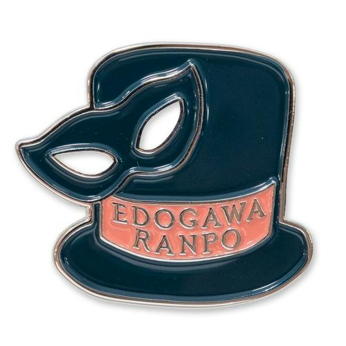 Dark teal enamel pin shaped like a top hat with an attached eye mask and a pink band reading “EDOGAWA RANPO” on a white background.
