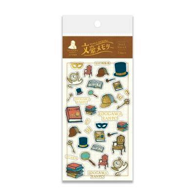 Packaged foil-stamped sticker sheet for 文豪メモリー showing various small stickers (hats, books, magnifying glass, chair).