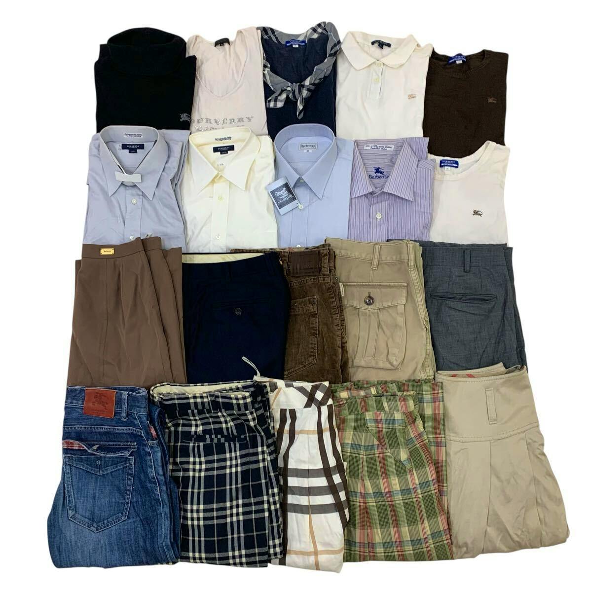 Folded men's cotton dress shirts and assorted Burberry clothing items arranged in rows with folded pants below.