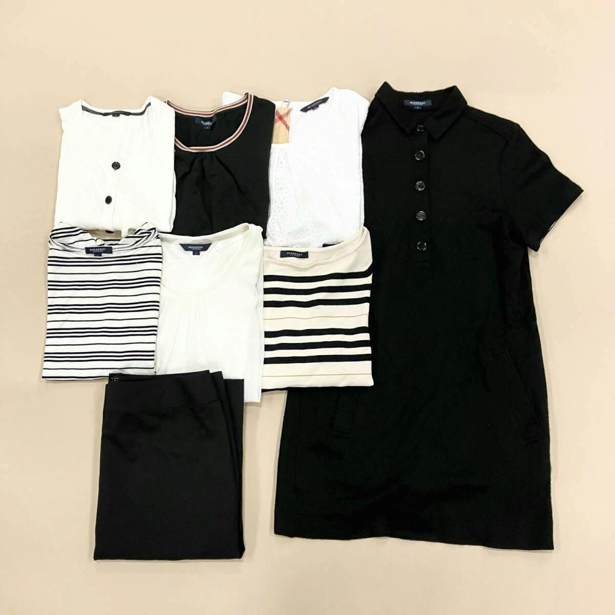 Eight Burberry clothing items folded and arranged on a light background.