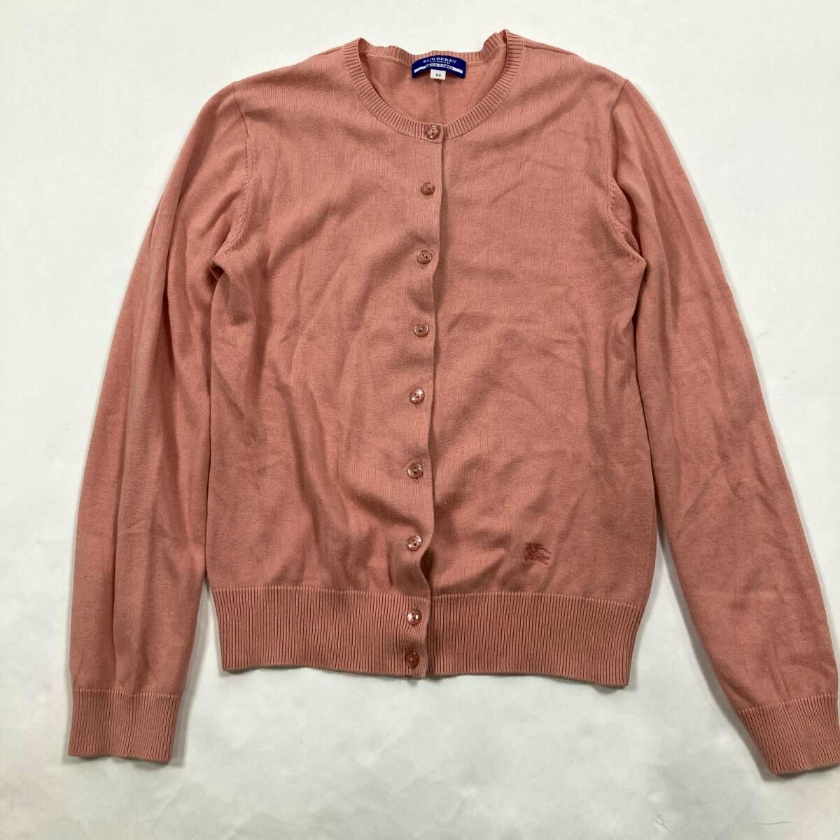 Pink long-sleeve cotton button-up cardigan laid flat with a visible Burberry Blue Label neck tag.