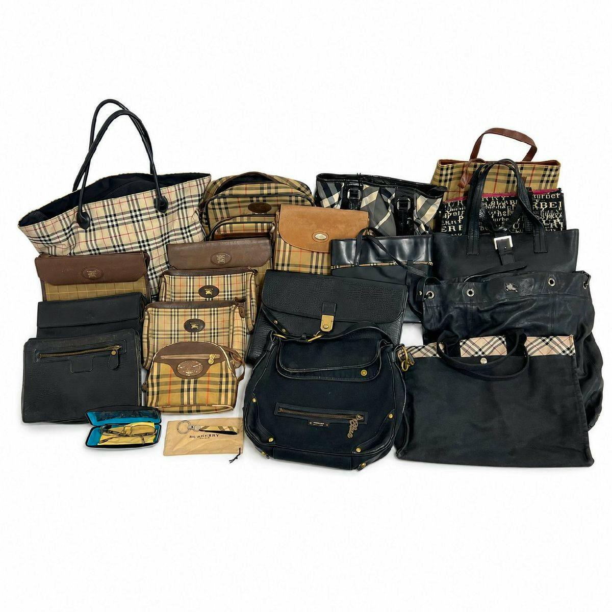 Group of Burberry bags and small accessories arranged together, showing Nova Check patterned and black styles.