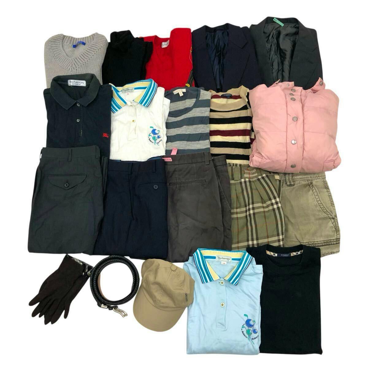 Flat lay of a bulk lot of Burberry/Burberrys mens clothing and accessories showing folded cotton T‑shirts and polos, pants, jackets, a belt, gloves, and a cap on a white background.