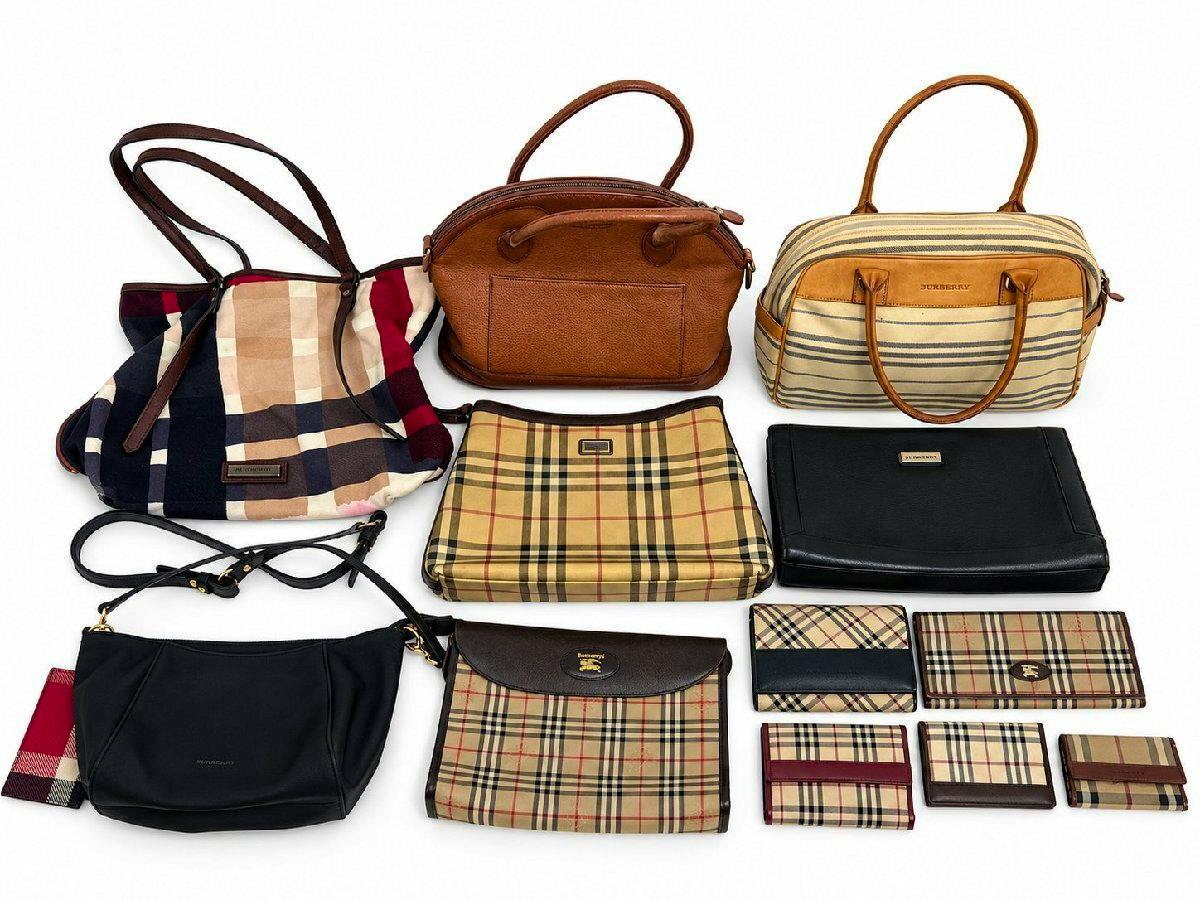 Twelve Burberry bags and wallets, including checked-pattern canvas and leather styles, arranged on a white background.