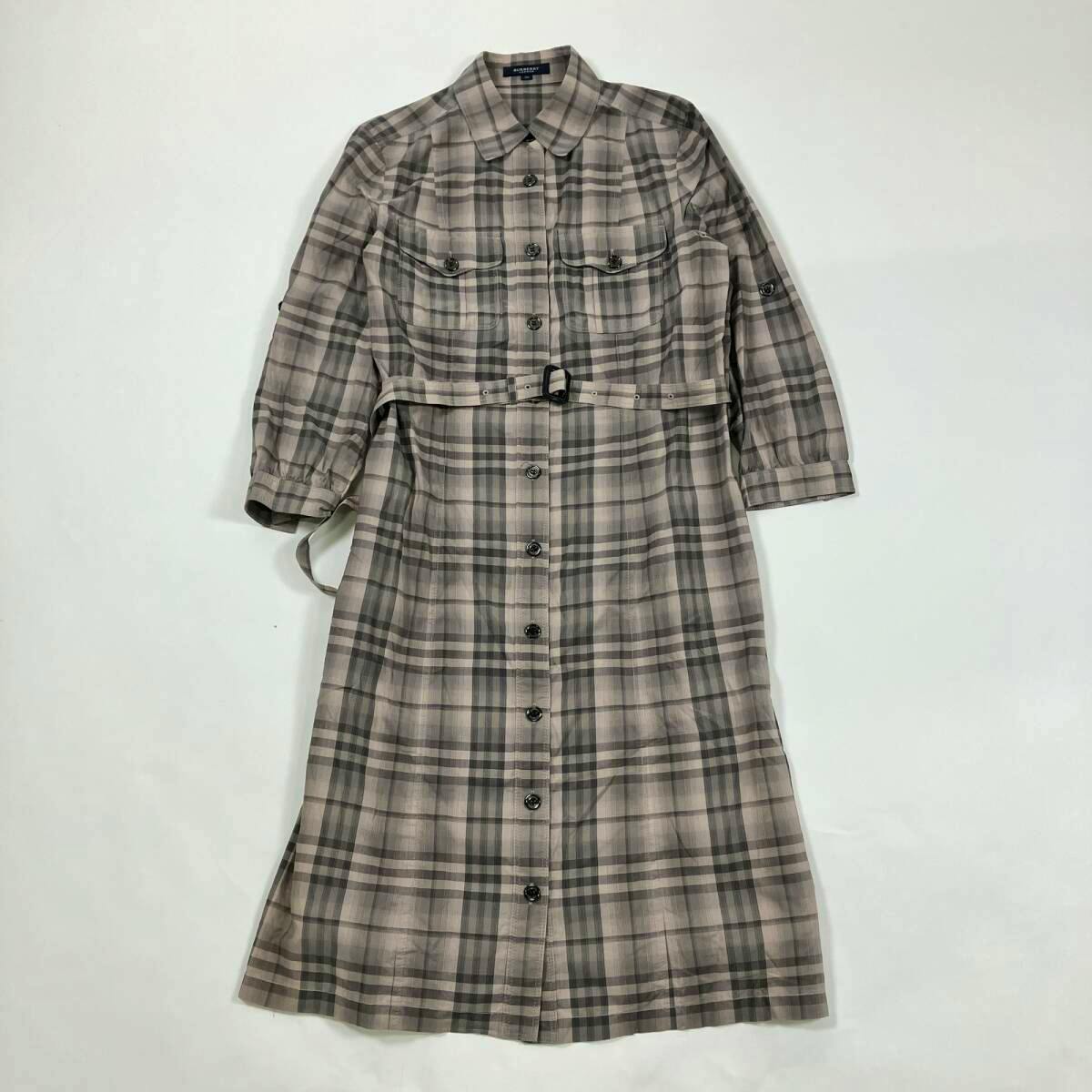 Burberry check shirt dress with half-length sleeves and a waist belt laid flat on a white background.