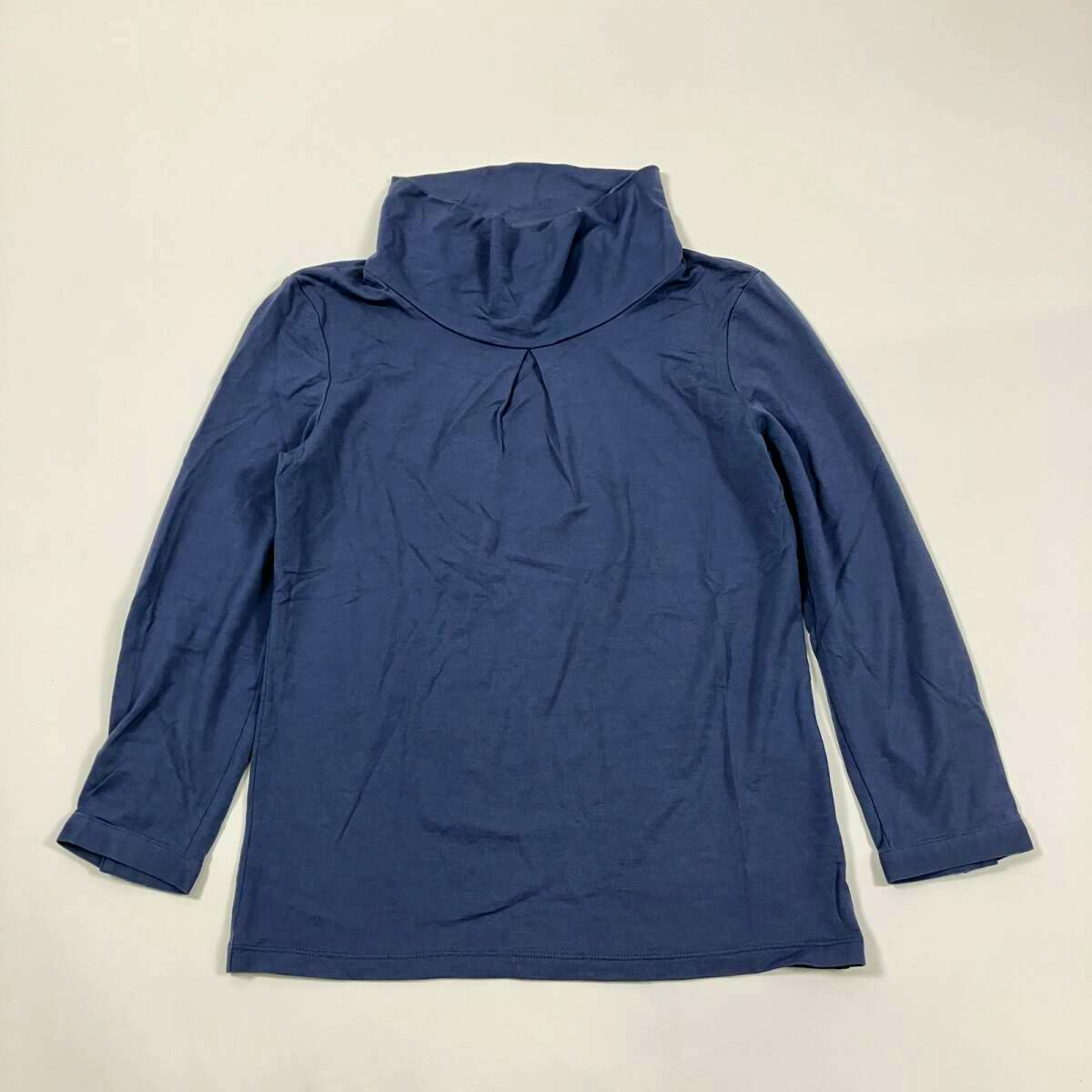 Blue high-neck long-sleeve women's sweater laid flat on a white background.