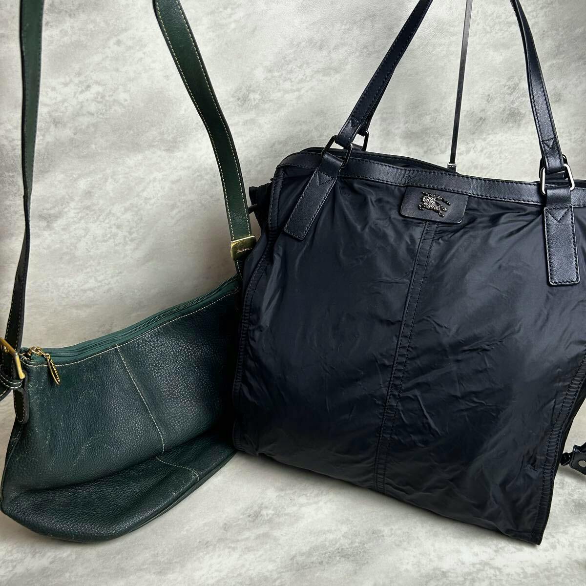 A black tote bag and a green shoulder bag shown side by side on a light background.