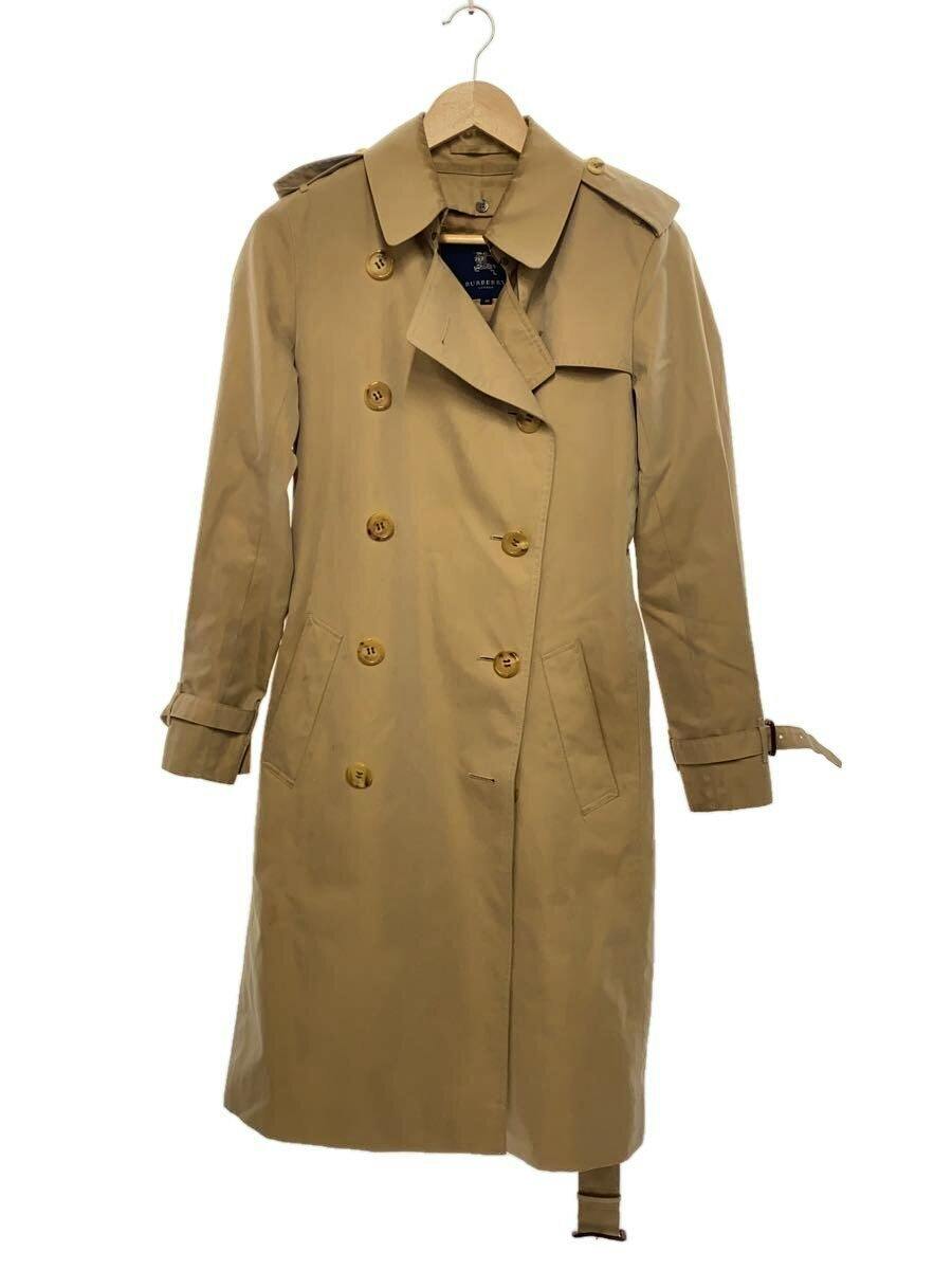 A camel-colored men's BURBERRY trench coat hanging on a hanger shown from the front.