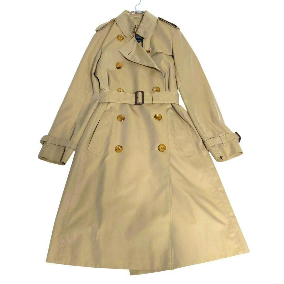 Beige Burberry London women's double-breasted cotton trench coat with belt laid flat on a white background.