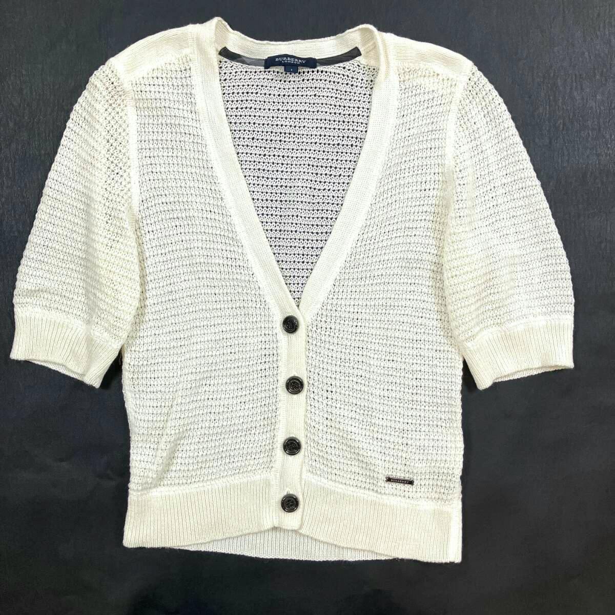 Ivory short-sleeve Burberry London knit cardigan with V-neck and four buttons laid flat on a dark background.