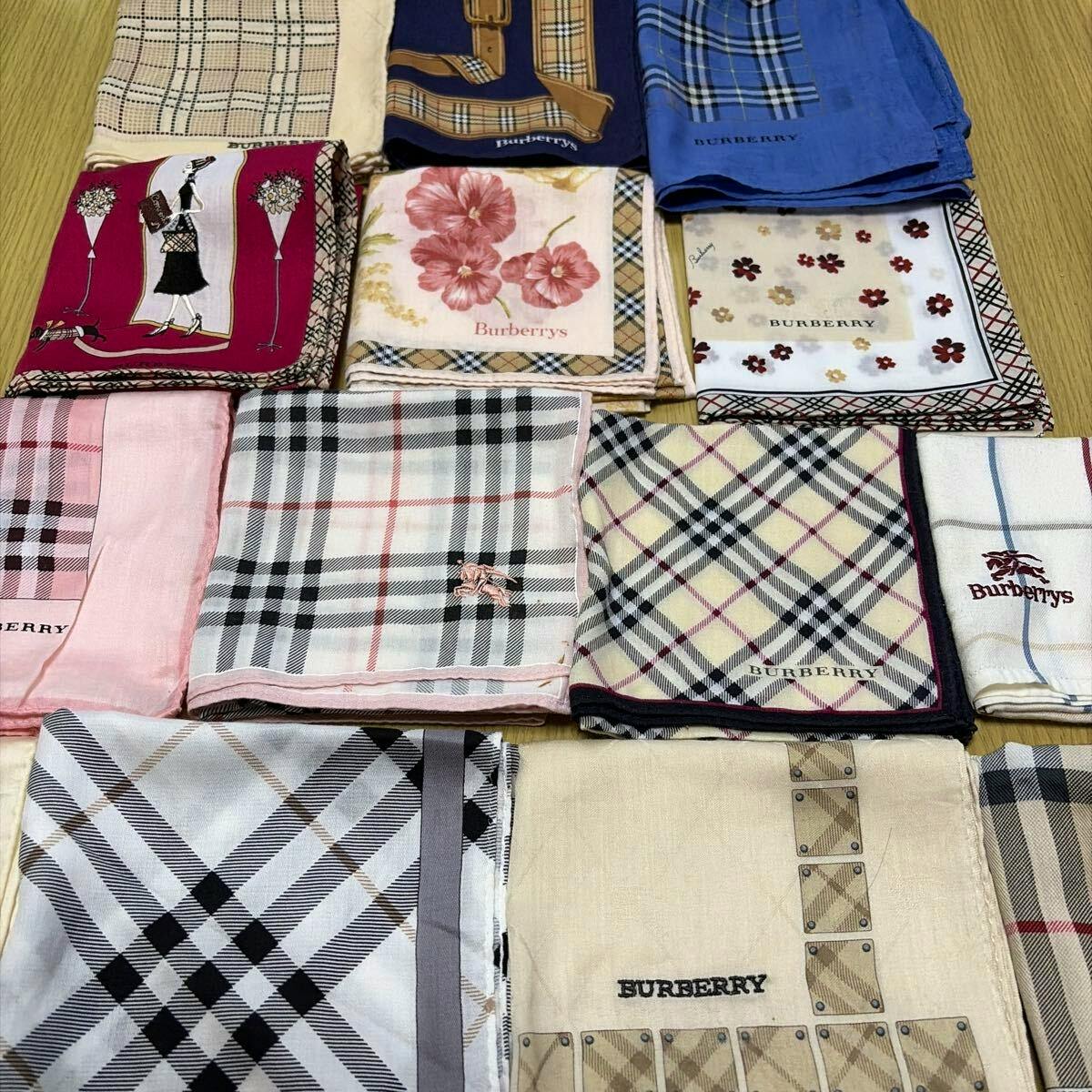 Multiple folded Burberry handkerchiefs with various check and floral patterns arranged on a flat surface.