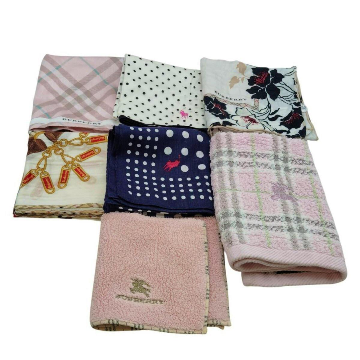 Seven folded cotton hand towels/handkerchiefs in assorted patterns (checks, polka dots, floral, navy with Polo logo, pink toweling) arranged on a white background.