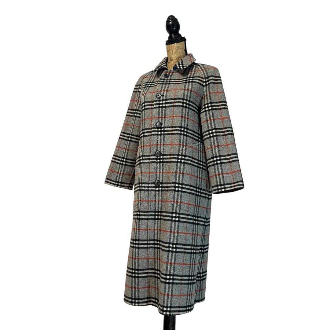 Burberry Nova Check long reversible coat (lamb) displayed on a mannequin showing the check side.