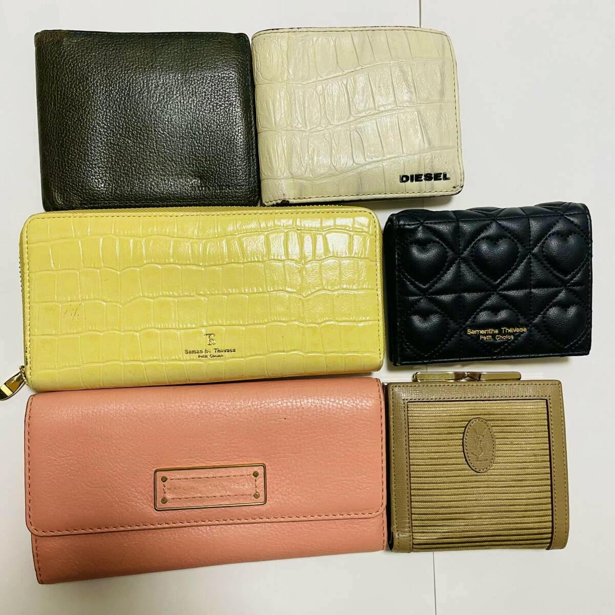 Six assorted wallets arranged flat on a white background.