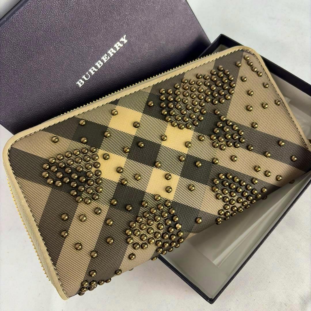 Burberry studded round-zip long canvas wallet with check pattern shown inside its box.