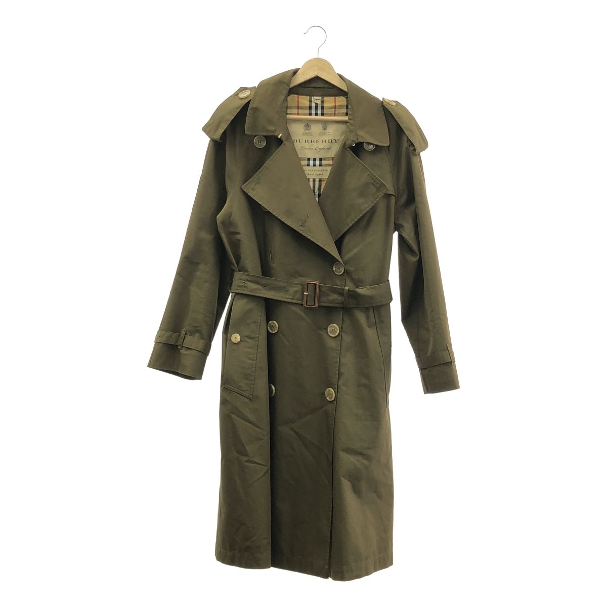 Khaki Burberry Westminster trench coat on a hanger, front view with belt and visible check lining.