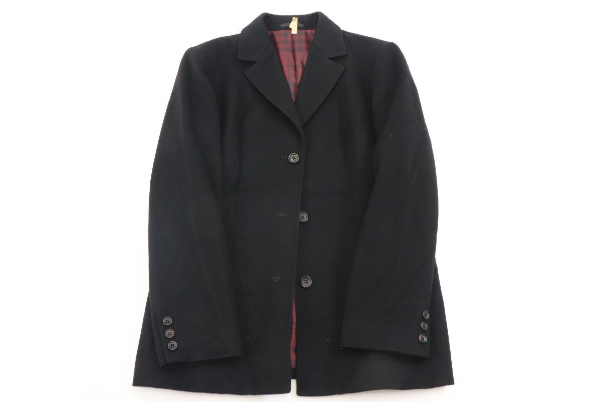 Front view of a men's Burberry black jacket laid flat, three-button closure with red tartan inner lining visible.