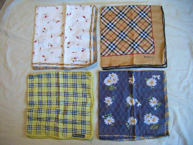 Four Burberrys handkerchiefs with different patterns arranged in a 2-by-2 grid on a light background.