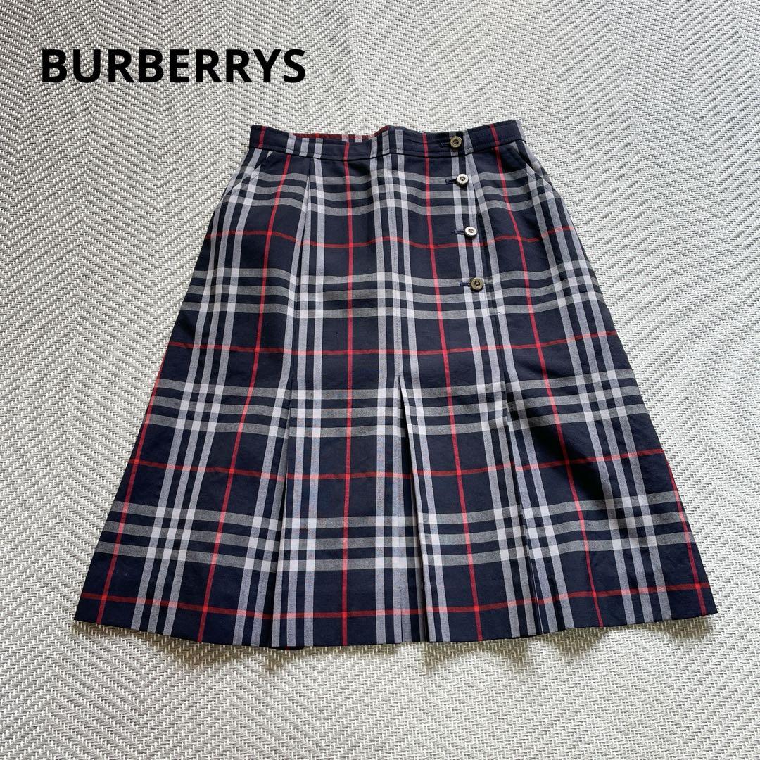 Navy Burberrys Nova Check skirt laid flat showing the front and button details.