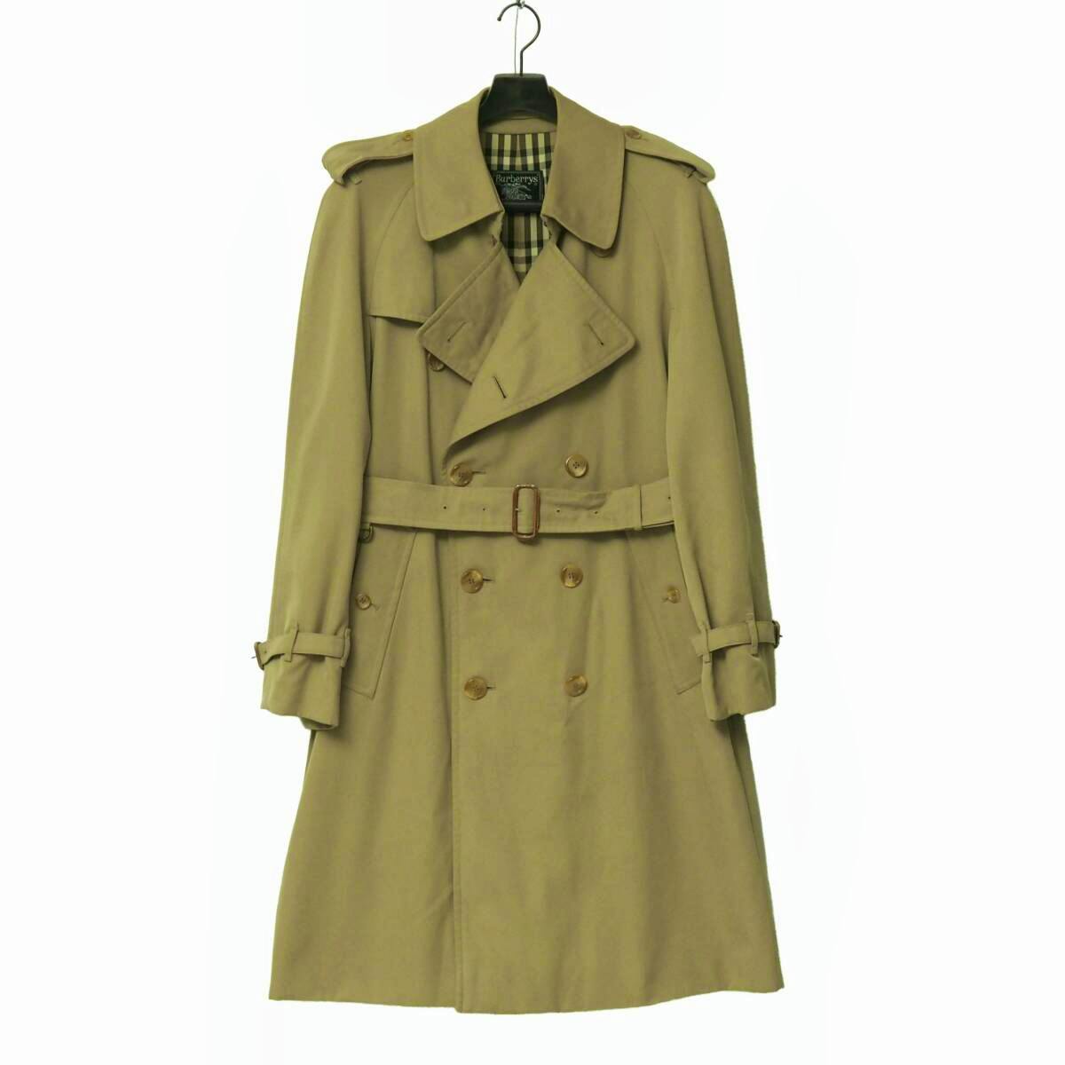Front view of a men's Burberry trench coat hanging on a hanger against a white background.