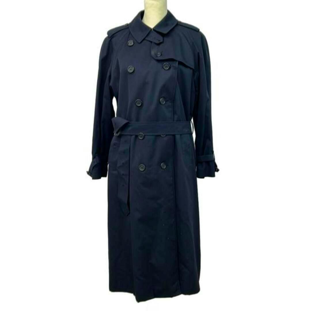 Front view of a navy long-sleeve trench coat displayed on a mannequin.