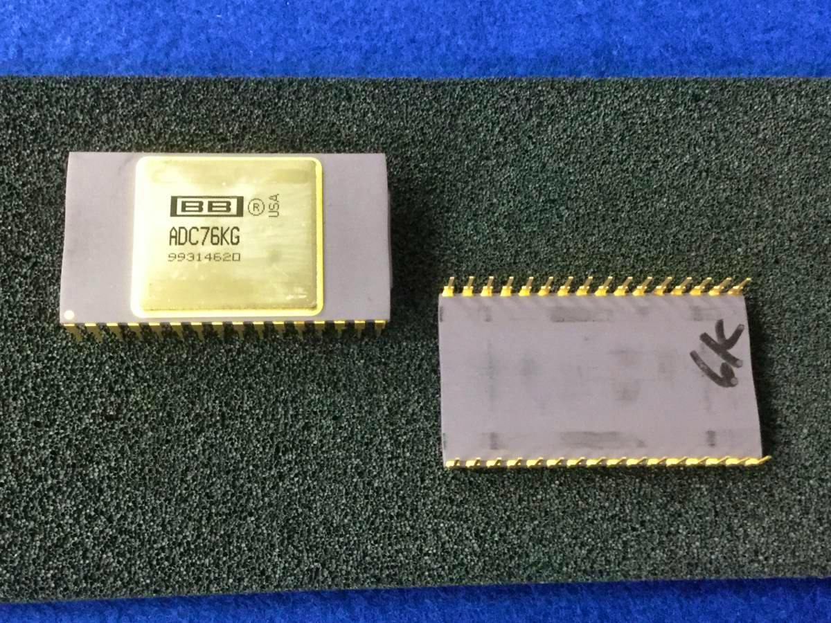 Two Burr‑Brown ADC76KG A/D converter ICs on foam, one showing the top marking and the other showing the underside pins.