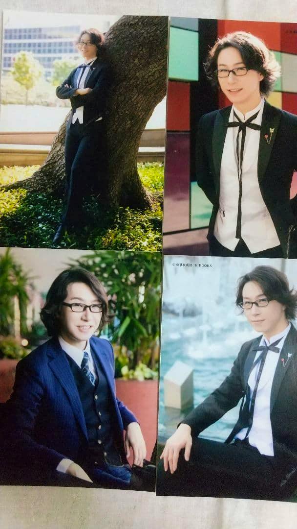A sheet of four printed portrait photographs from the 執事歌劇団 伊織 テキサス photo set showing a person in suits and glasses in different poses.