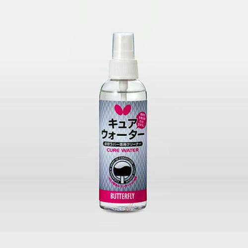 A clear plastic spray bottle of [Butterfly] キュアウォーター freshening spray with a silver and pink label and a white spray nozzle.