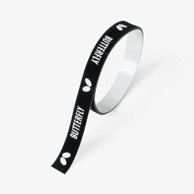 Black edge protector tape (plastic) printed with white "BUTTERFLY" text and logos, shown partially unrolled.