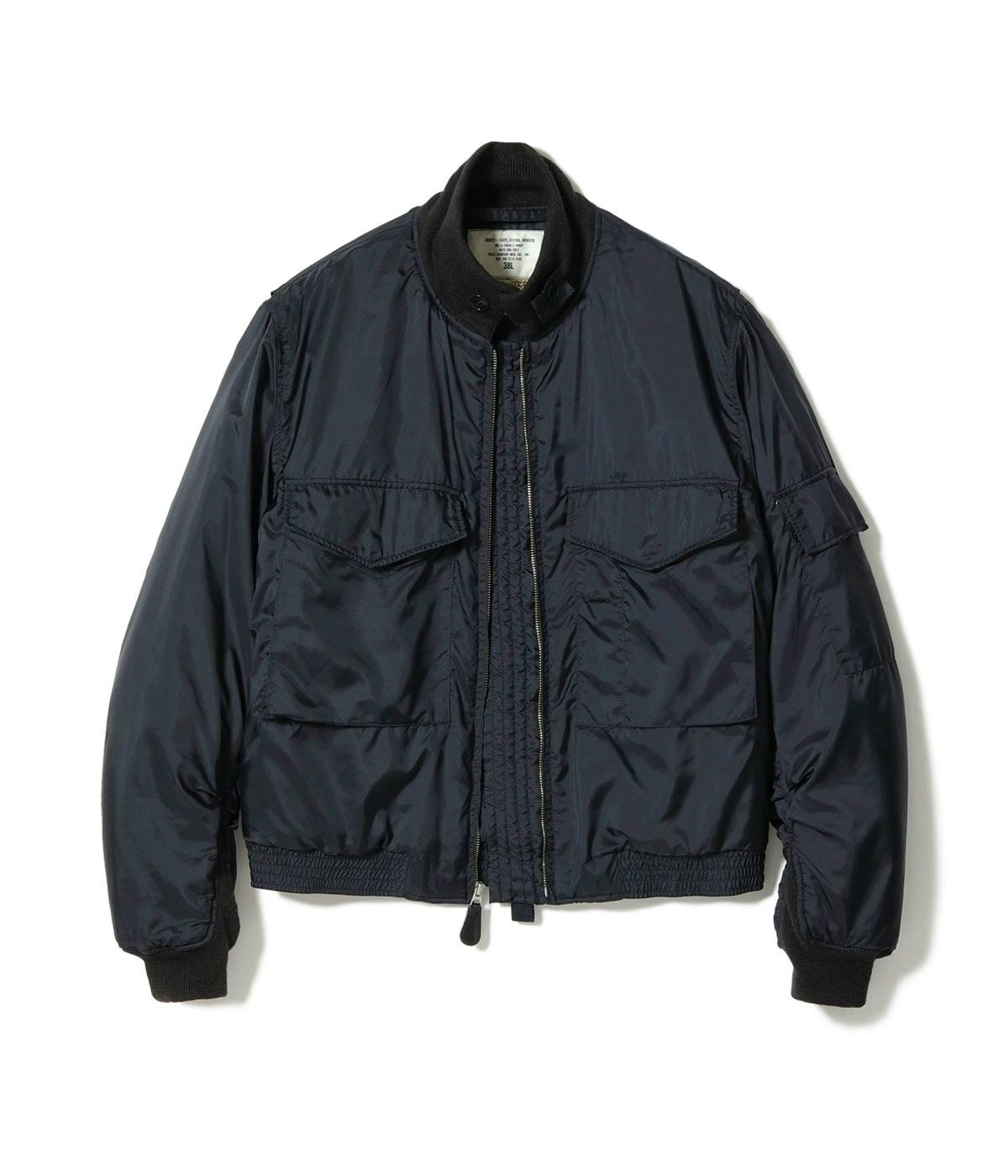 Front view of a black nylon men's jacket with zipper closure, flap chest pockets, and ribbed collar and cuffs on a white background.