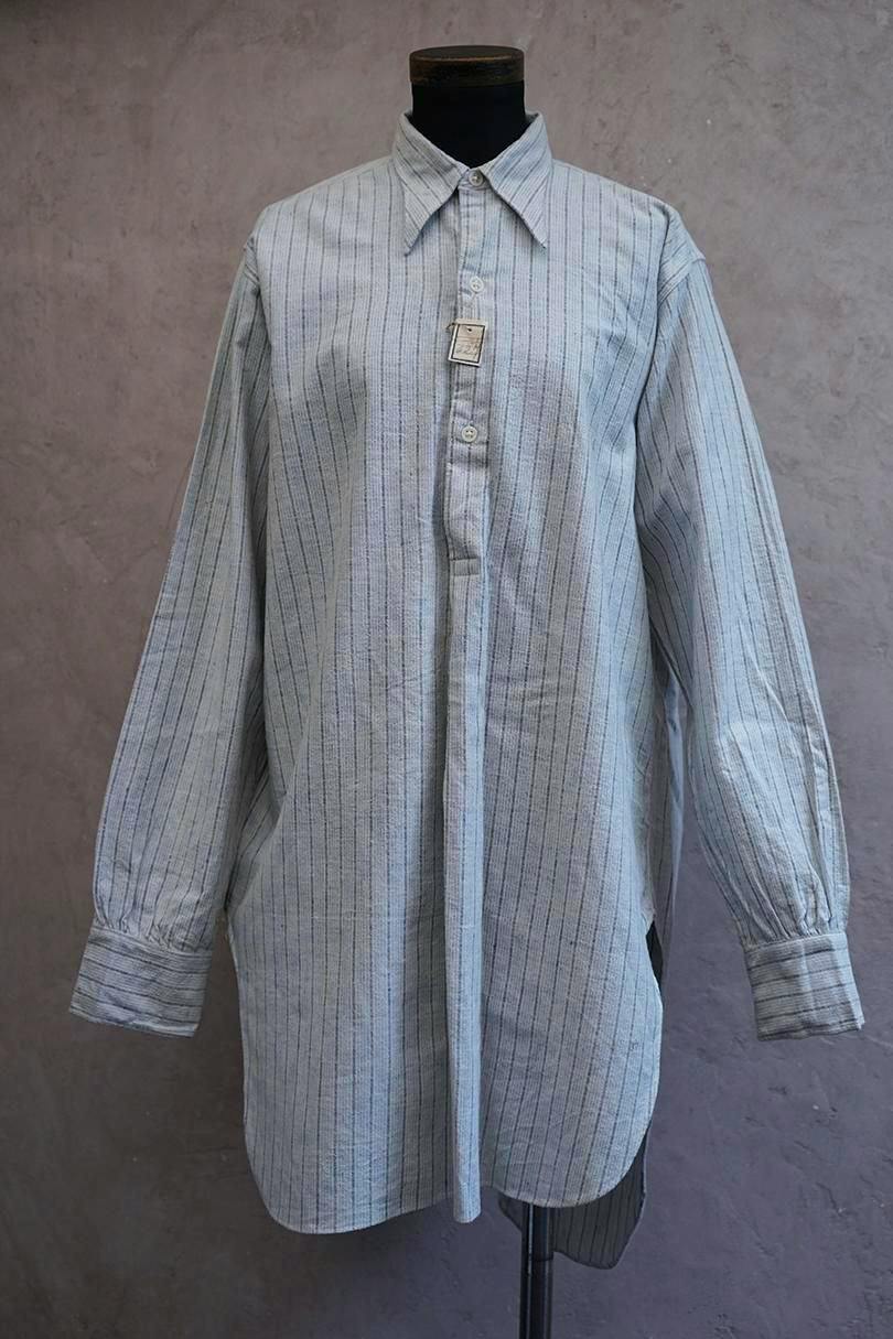 Front view of the cir. 1940's striped cotton men's shirt ("indigo") displayed on a mannequin.