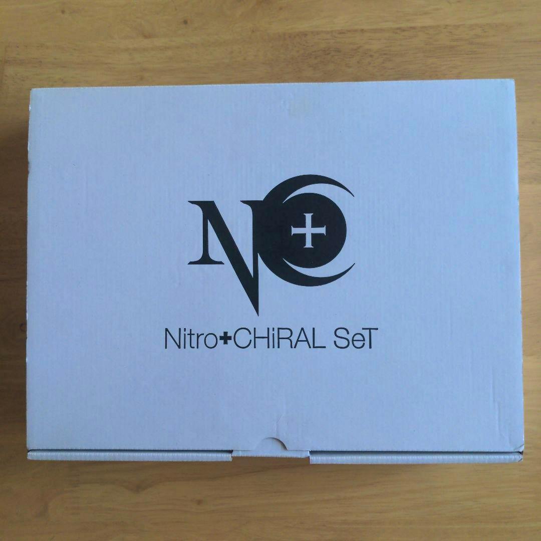 White box with the Nitro+CHIRAL SeT logo printed on the top, photographed on a wooden surface.