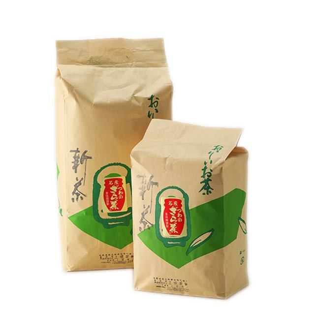 Two beige paper bags of kawarake-tsumei (ざら茶) tea packaging with green graphics on a white background.