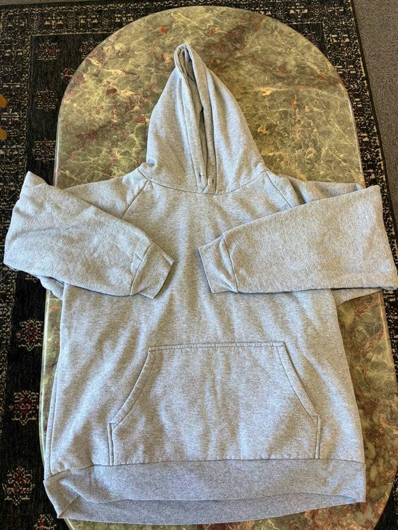 Gray Camber Chill-Buster hoodie (size M) laid flat showing the hood, kangaroo front pocket, and long sleeves.