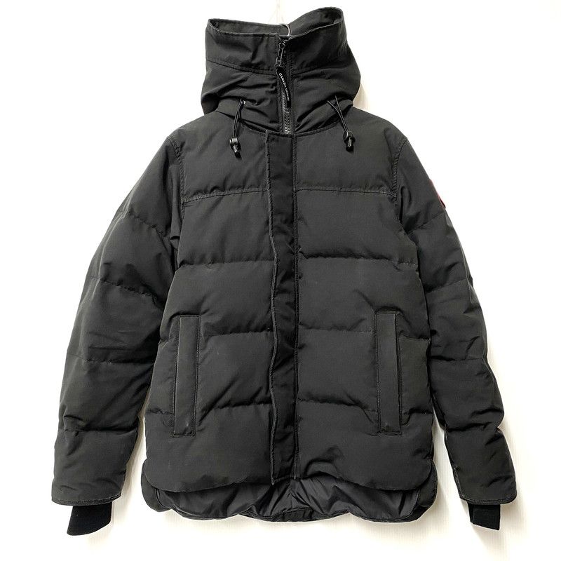 Front view of a black men's MacMillan nylon parka with hood and zip closure laid flat.