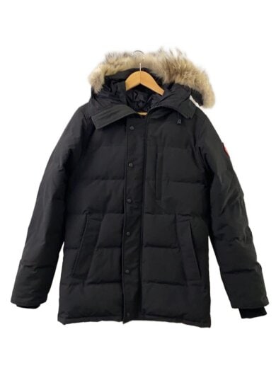 Front view of a black Canada Goose men's down jacket with a fur-trimmed hood on a hanger.